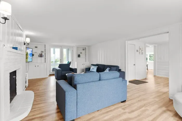 Spacious, open concept, living room with smart TV