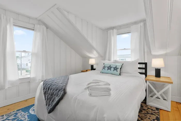 Primary bedroom with king bed and smart TV