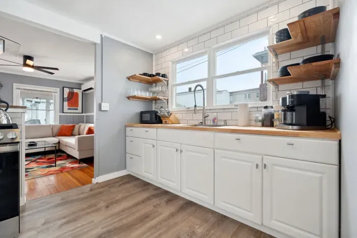 Full kitchen with coffee maker and microwave