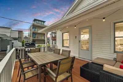 Spacious deck with 6-person dining table, outdoor sectional, and grill!