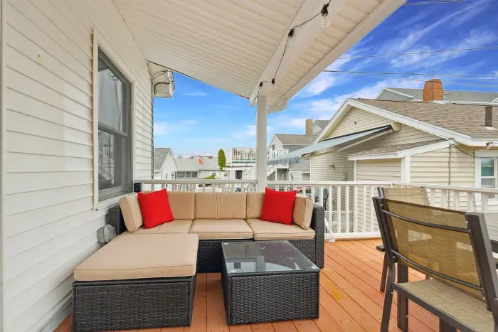Spacious deck with 6-person dining table, outdoor sectional, and grill!
