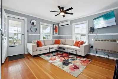 Relaxing lounge area with an inviting sofa and smart TV!