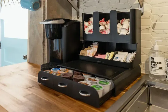 Complimentary Keurig coffee and tea provided along with sugar and creamers.