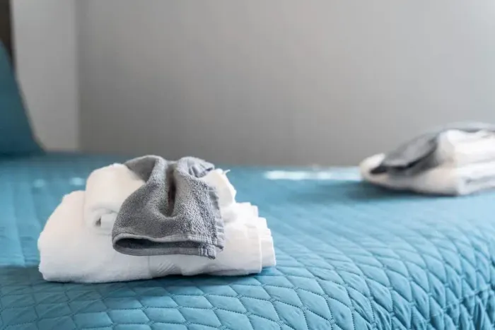 Bedroom #1 with queen bed, and mounted flatscreen smart Roku TV