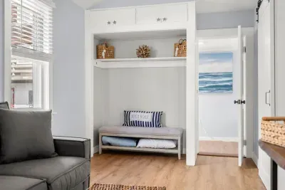 Living room with couch and smart Roku TV to enjoy your streaming services and basic cable.