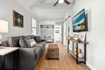 Living room with couch (not a sleeper sofa) and smart Roku TV to enjoy your streaming services and basic cable.
