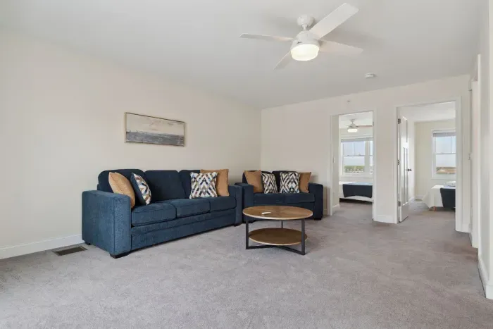 Spacious secondary living area on the second floor, perfect for relaxation and entertainment.