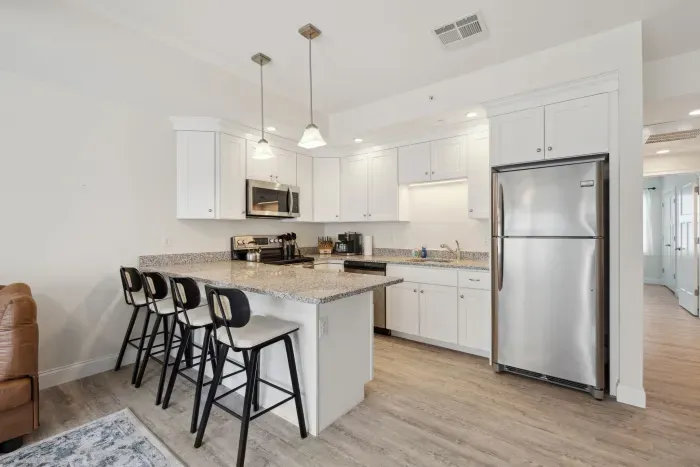 Modern kitchen with bar stool counter seating for 4