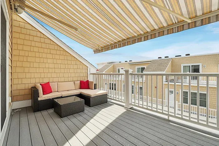 Relax and watch the sunset on our expansive balcony - remote controlled expandable awning