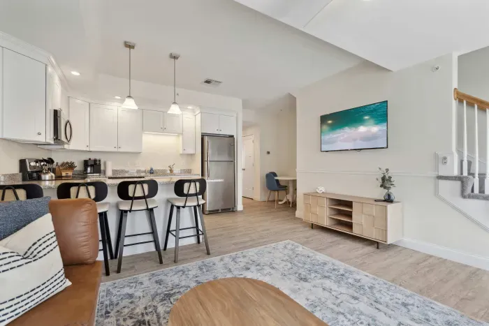 Roomy living room adjacent to the kitchen, complete with a Roku TV.