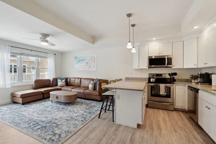 Roomy living room adjacent to the kitchen, complete with a Roku TV.