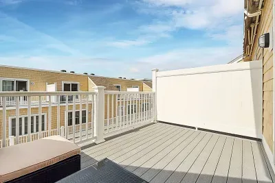 Relax and watch the sunset on our expansive balcony - remote controlled expandable awning