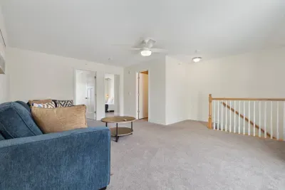 Spacious secondary living area on the second floor, perfect for relaxation and entertainment.