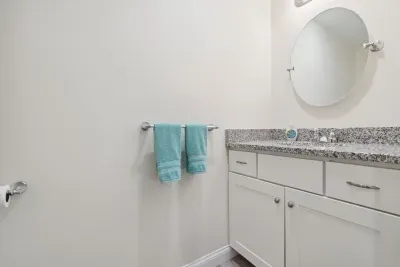 Half bathroom between kitchen and master bedroom