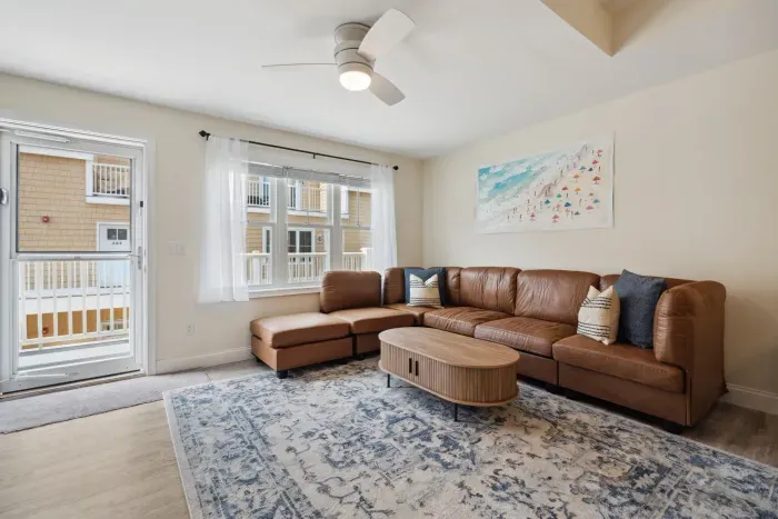 Roomy living room adjacent to the kitchen, complete with a Roku TV.