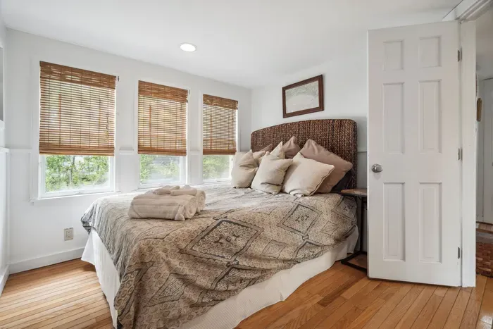 The second bedroom, with a seagrass theme and a queen bed. Clean linens provided