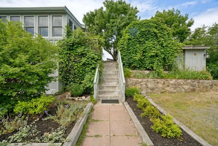 The main entry to the home has about 12 steps up to the home. Please be prepared as these steps are relatively steep. There is another driveway on the right where there are only 2 steps. Parking for 4 vehicles in the driveway
