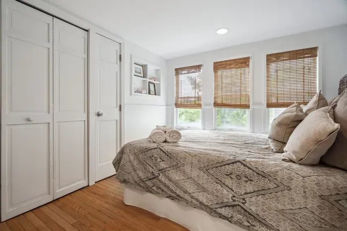 The second bedroom, with a seagrass theme and a queen bed. Clean linens provided. The washer and dryer are located in this closet. 