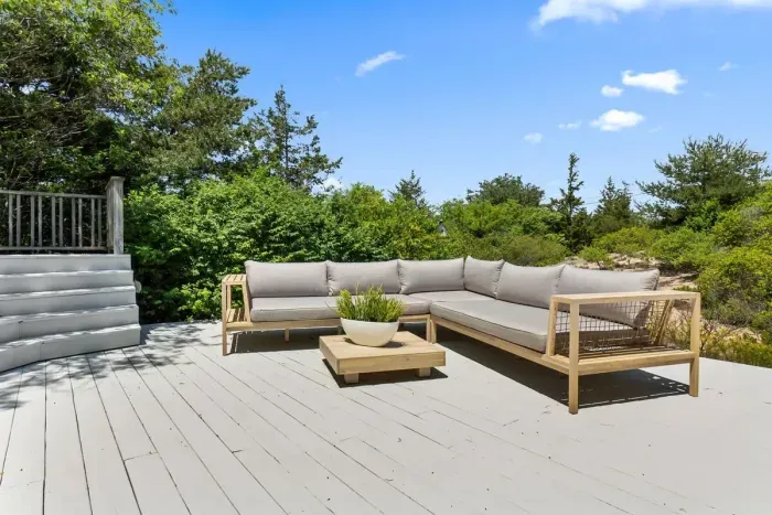 Lounge on the lower deck surrounded by Plum island old growth trees