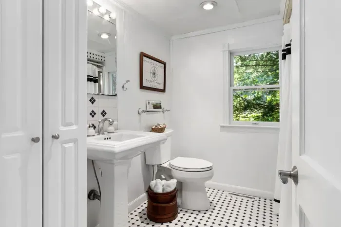 The full bathroom is located in the hallway off the kitchen. There is a shower and tub combo. Clean towels provided for all guests