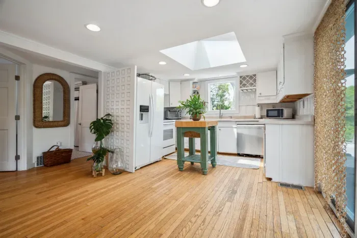 The fully equipped kitchen has everything necessary to make a great meal. A large skylight brings in amazing natural light