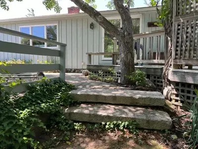 The alternative access to the main entry is via these two granite steps.