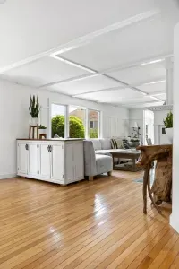 The open kitchen and living area are perfect on warm summer days with the sea breeze whipping through the windows