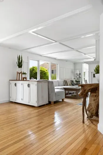 The open kitchen and living area are perfect on warm summer days with the sea breeze whipping through the windows