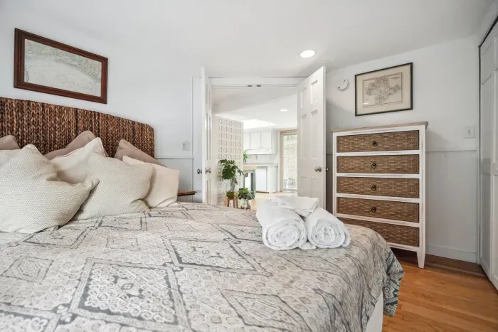 The second bedroom, with a seagrass theme and a queen bed. Clean linens provided