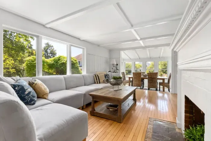 The living room has amazing natural light, a large sectional, and a large smart tv. Please note the fireplace is inoperable. 