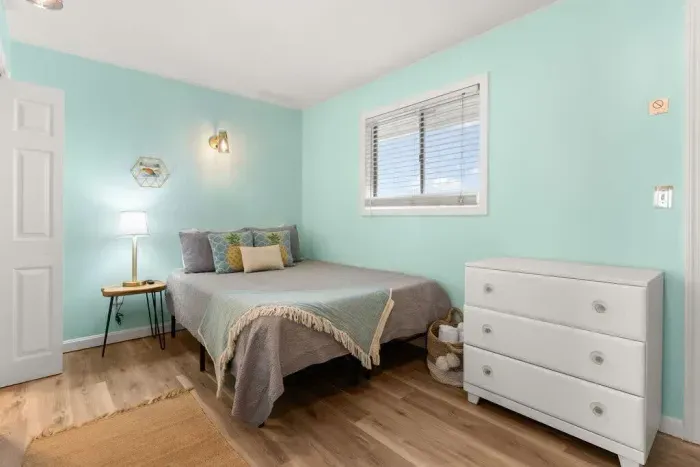 Bedroom with queen bed and flat screen smart TV