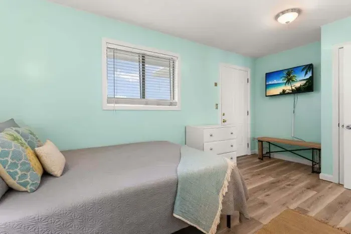 Bedroom with queen bed and flat screen smart TV