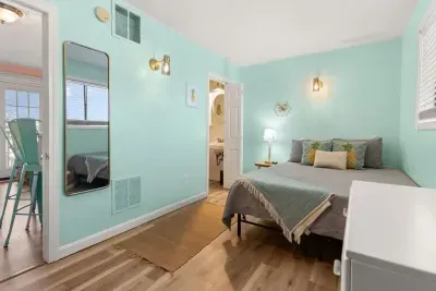 Bedroom with queen bed and flat screen smart TV