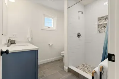 Master bedroom ensuite with heated floors and tiled shower! Clean towels provided