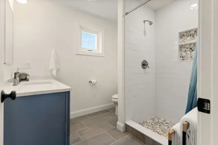 Master bedroom ensuite with heated floors and tiled shower! Clean towels provided