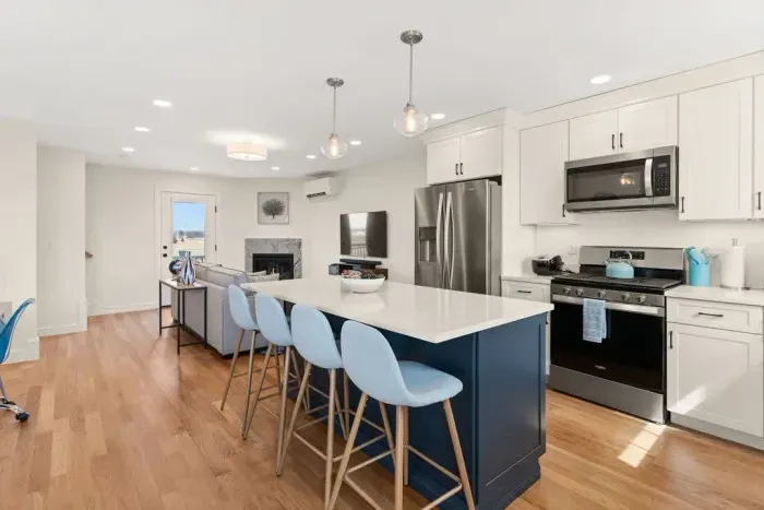 Open Kitchen, living room and dining room with high-end finishes/appliances and gas fireplace