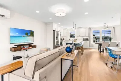 Open Kitchen, living room and dining room with high-end finishes/appliances and gas fireplace