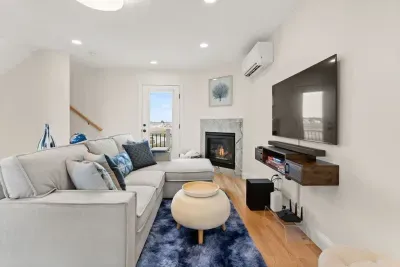 Open Kitchen, living room and dining room with high-end finishes/appliances and gas fireplace