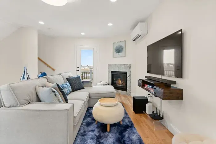 Open Kitchen, living room and dining room with high-end finishes/appliances and gas fireplace