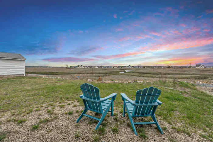 Outdoor lounge area with views of the marsh