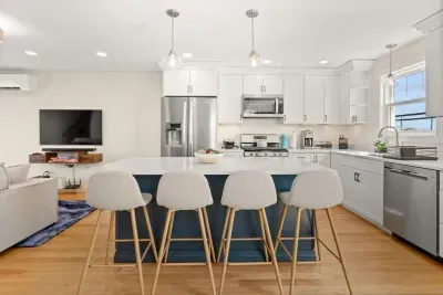 Open Kitchen, living room and dining room with high-end finishes/appliances and gas fireplace