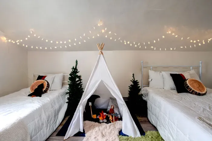 One full bed, one twin, a kids tent with lights