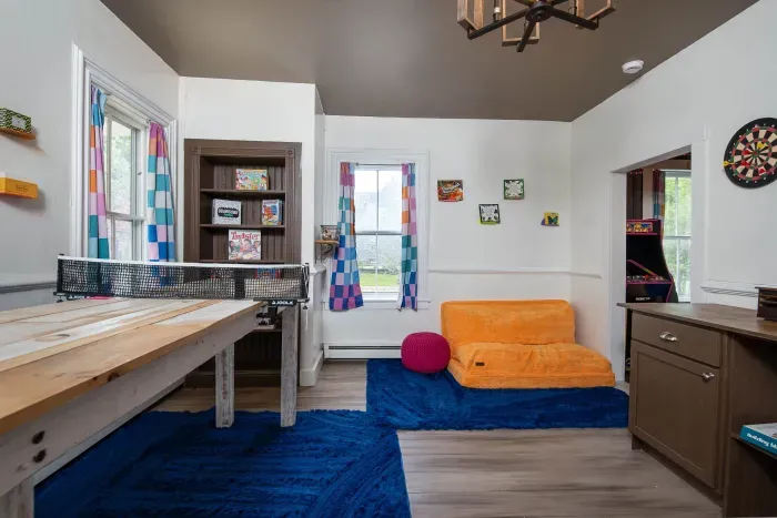 The Game Room, with ping pong, lots of games, another Roku TV and foosball in the adjacent room.