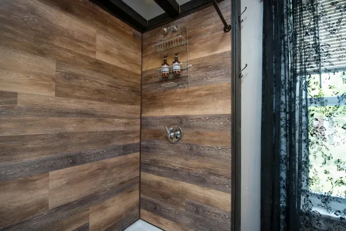 1st bedroom ensuite full bathroom with double vanity and provided hand soap, shampoo, body wash and towels