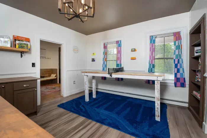 The Game Room, with ping pong, lots of games, another Roku TV and foosball in the adjacent room.
