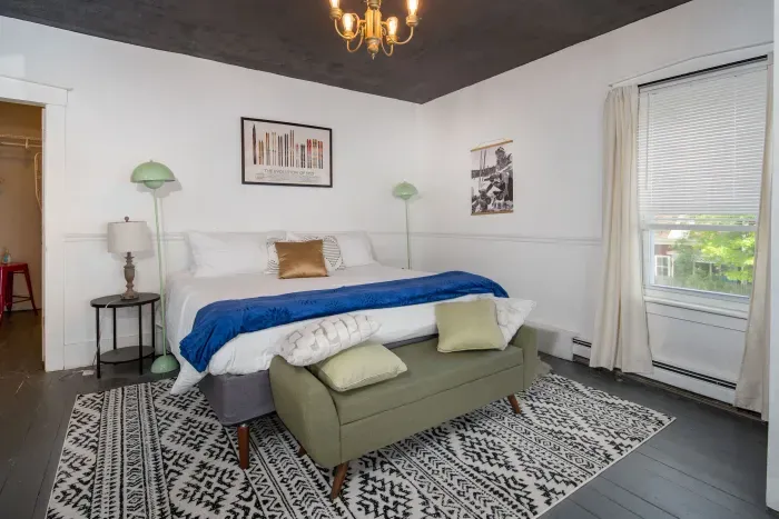 1st King bedroom with provided bedding, extra blankets and towels