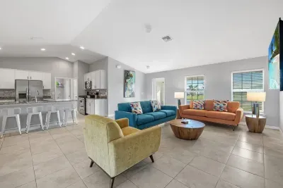 Open living room and kitchen with 65 inch flat screen smart TV, stong WiFi and fully-equipped kitchen with all major appliances.