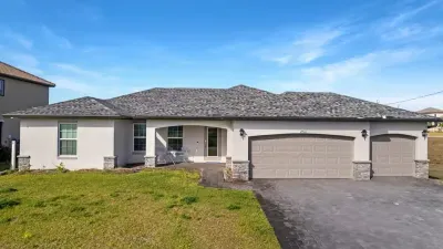 View of our home from the Street. We can park up to 6 vehicles in our 3-car garage and driveway from the Street