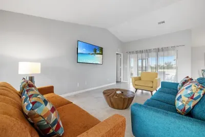 Open living room and kitchen with 65 inch flat screen smart TV, stong WiFi and fully-equipped kitchen with all major appliances.