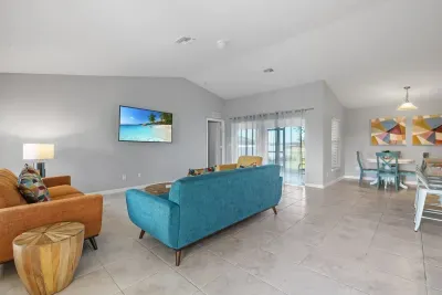 Open living room and kitchen with 65 inch flat screen smart TV, stong WiFi and fully-equipped kitchen with all major appliances.